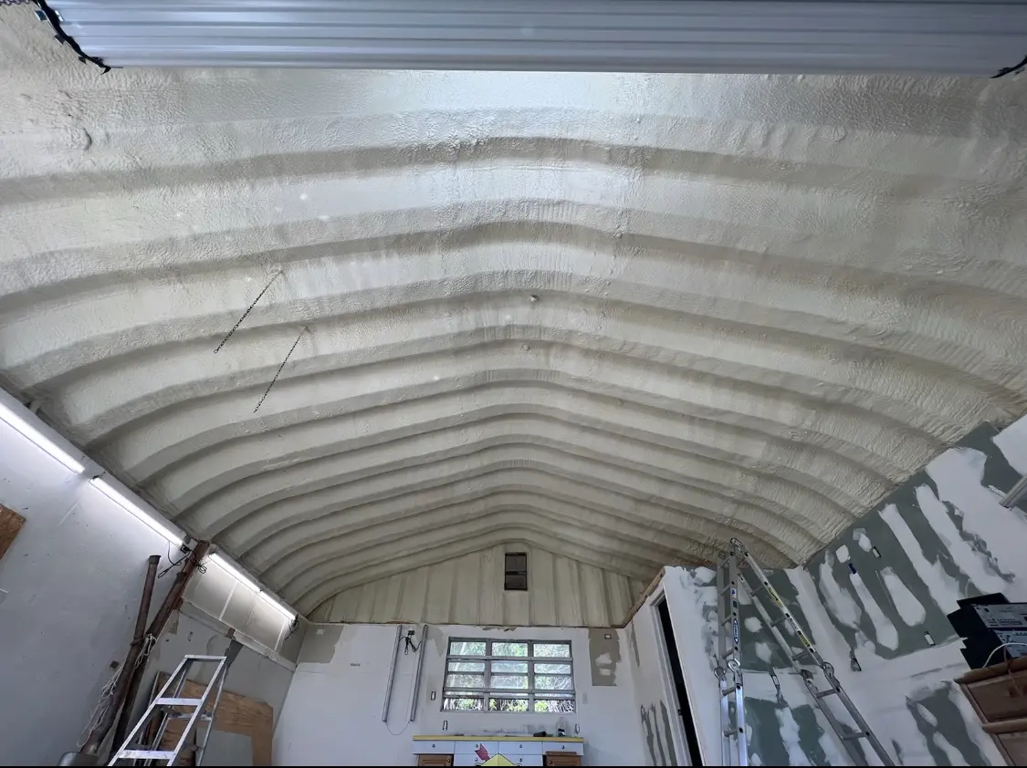 Spray polyurethane foam applied to the underside of a metal roof deck in Waterboro
